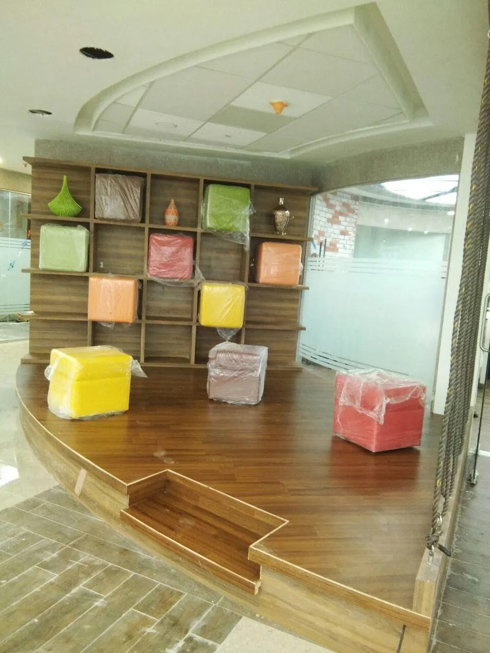 Industrial Showroom Gallery with Modern Reception and Technical Component Display Corporate Office Layouts Desk and Decor 