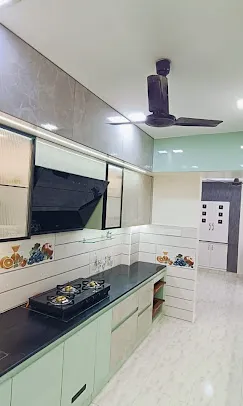 Straight-Line Modular Kitchen – Pastel Green & Marble Finish Modular Kitchen Desk and Decor 