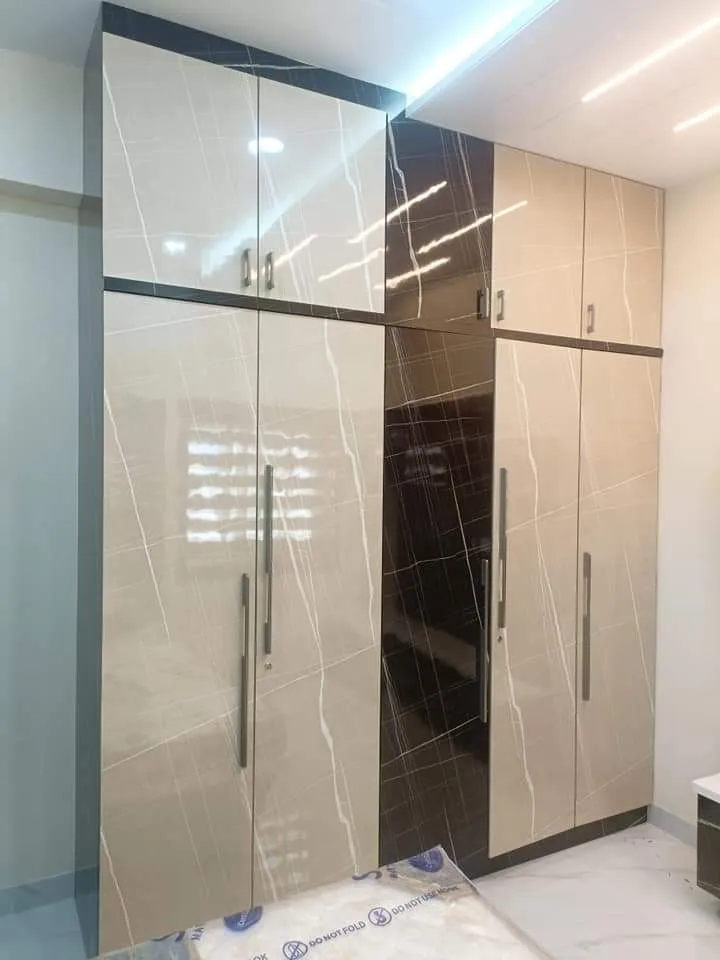 Two-Tone High-Gloss Wardrobe with Marble-Texture Accents Hinged Wardrobes Desk and Decor 