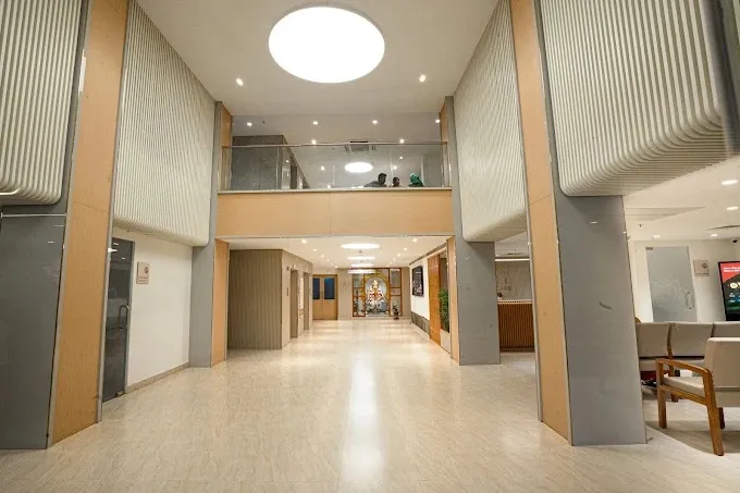 Hospital Waiting/Reception Lounge with Symmetrical Seating Healthcare Interior Design Desk and Decor 