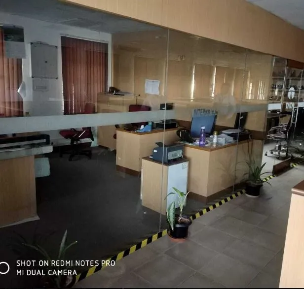 Commercial Office Reception & Workstation Area Cabin-Based Office Layout Desk and Decor 