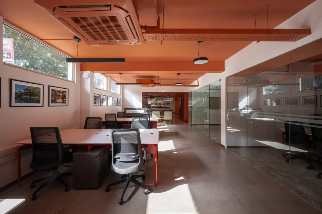 Industrial-Style Open Office Workspace with Exposed Ceiling Modern Office Designs Desk and Decor 