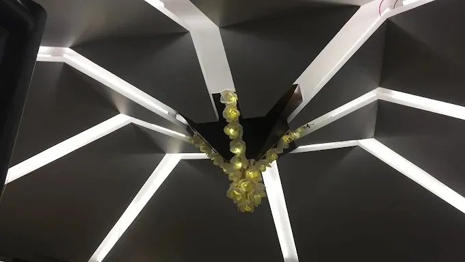 Geometric False Ceiling with Linear LED Channels and Floral Chandelier Architectural False Ceiling & Lighting Desk and Decor 