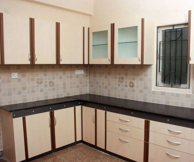 L-Shaped Modular Kitchen with Wood Grain Finish & Circular Accent Design Modular Kitchen Desk and Decor 