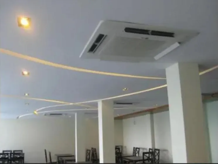 Commercial Restaurant Dining Hall with Wavy Ceiling Lights Fine Dining Restaurant Desk and Decor 