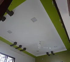 Geometric False Ceiling with Orange Beam Accents Architectural False Ceiling & Lighting Desk and Decor 
