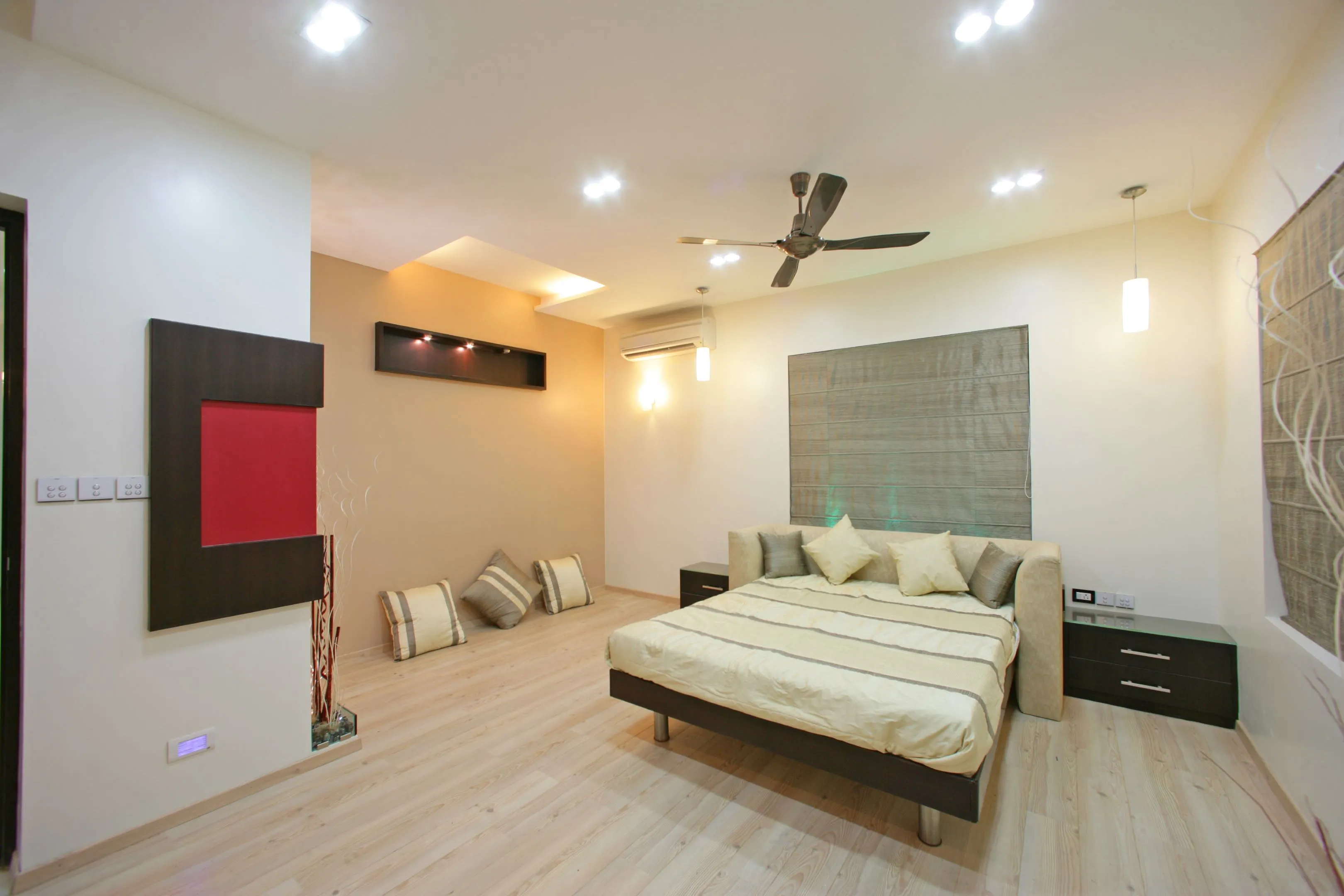 Contemporary Bedroom with Textured Grey Headboard & Red Accent Wall Modern Bedroom Desk and Decor 