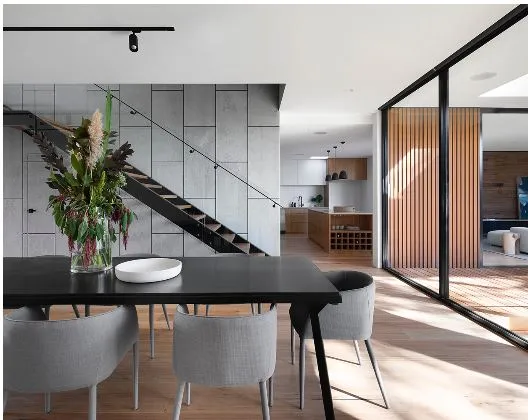 Dining Area with Open Staircase & Kitchen — Multi-Level Residence with Modern Dining Room Designs at Deskanddecor
