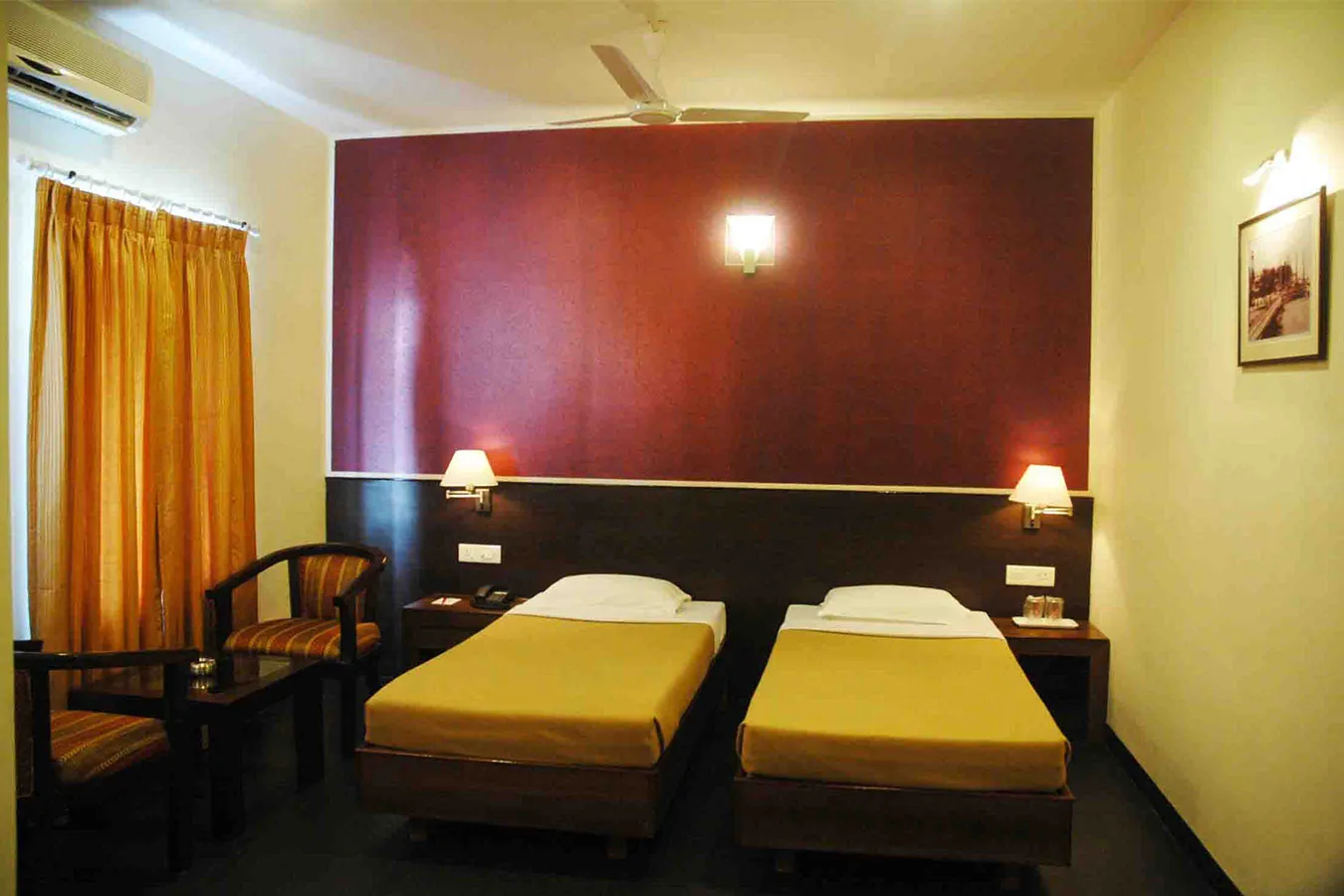 Twin Bed Hotel Room with Maroon Feature Wall with Guest Room / Bedroom at Deskanddecor