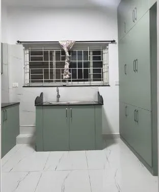 Sage Green Modular Kitchen with Tall Pantry and Sink Island with Modular Kitchen at Deskanddecor
