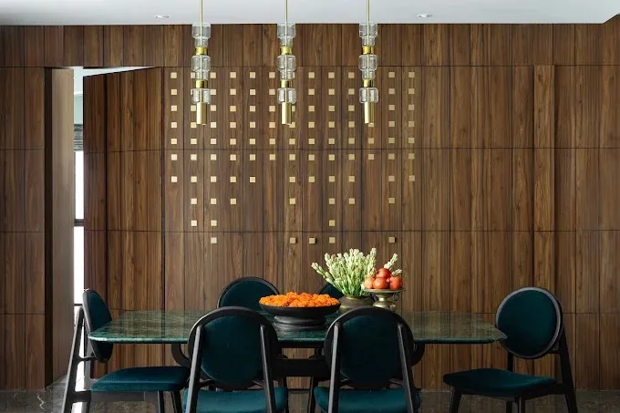 Dining Room with Brass-Inlay Wood Paneling & Green Marble Table with Modern Dining Room Designs at Deskanddecor