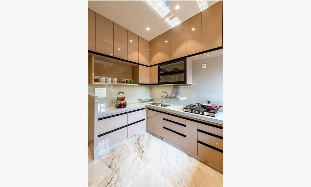 L-shaped kitchen layout features a sophisticated blend of functionality with Modular Kitchen at Deskanddecor
