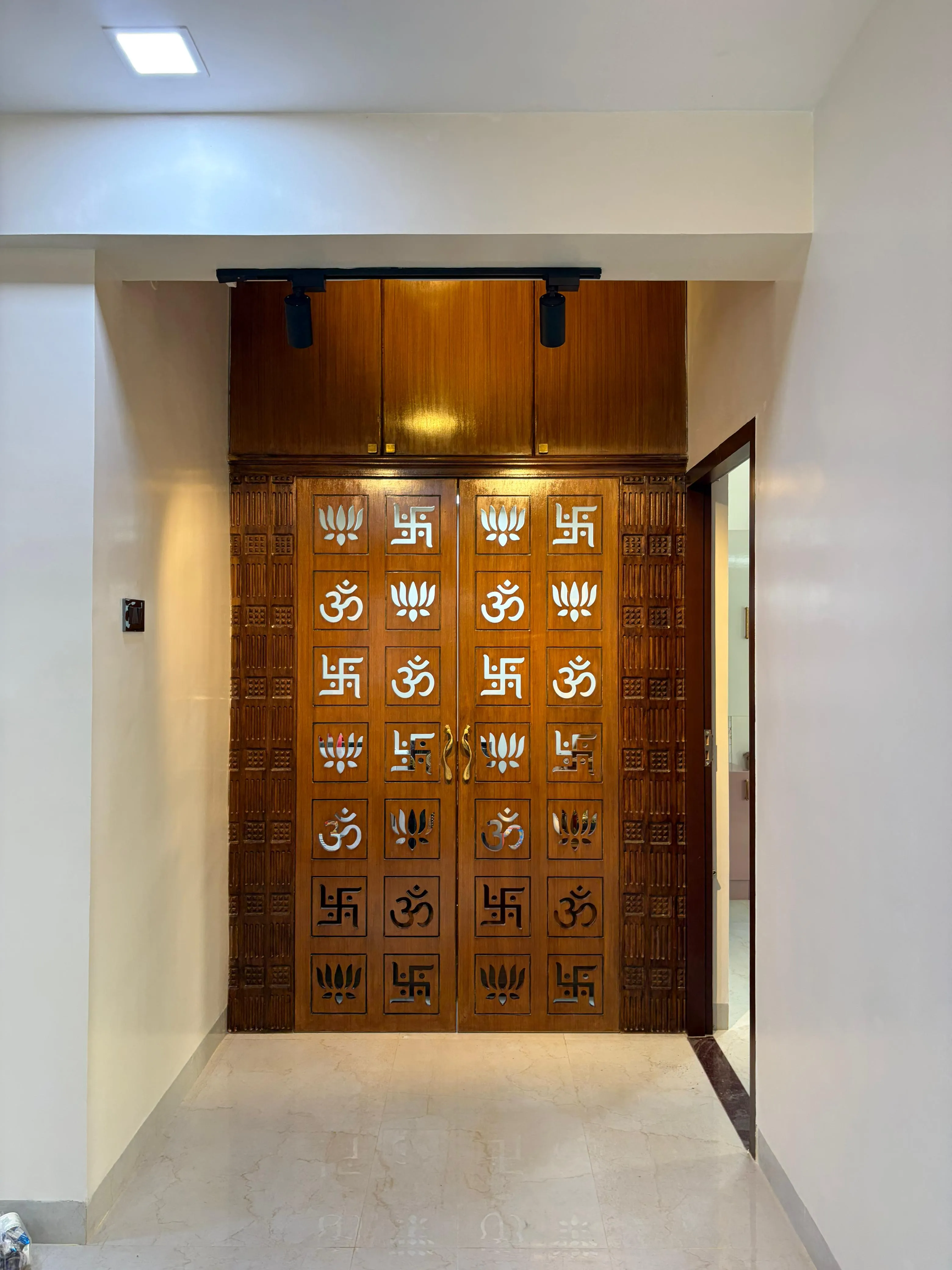 Modern Traditional Pooja Room Entrance Hand-Carved Teak Wood Door with Sacred CNC-Cut Motifs with Floor Standing TV Units at Deskanddecor