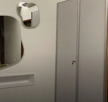 symmetric Irregular Wall Mirrors with Built-in Niche and Wardrobe with Modular Wardrobe at Deskanddecor
