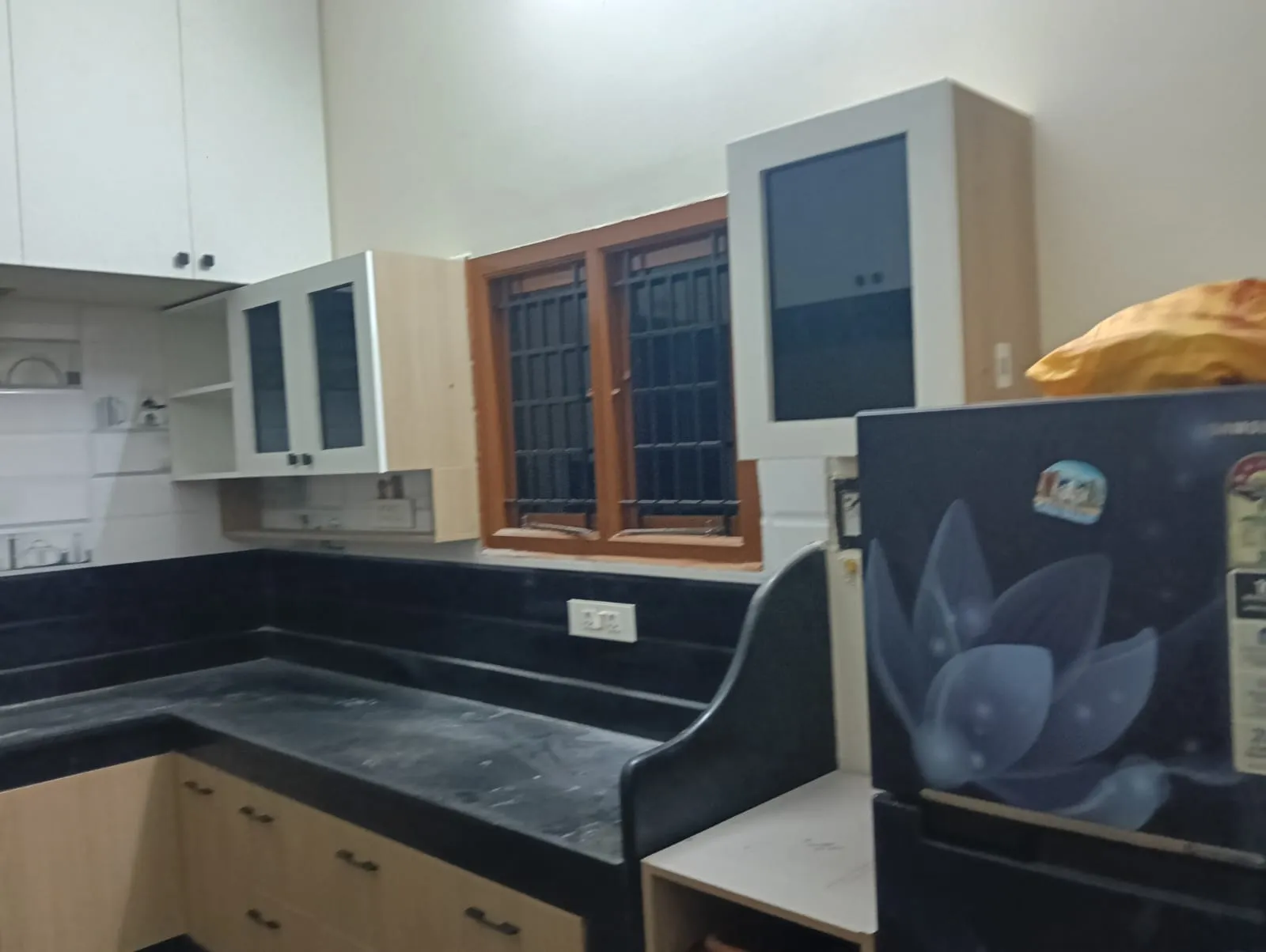 A Brown Aluminium window with Quartz Countertops at Deskanddecor
