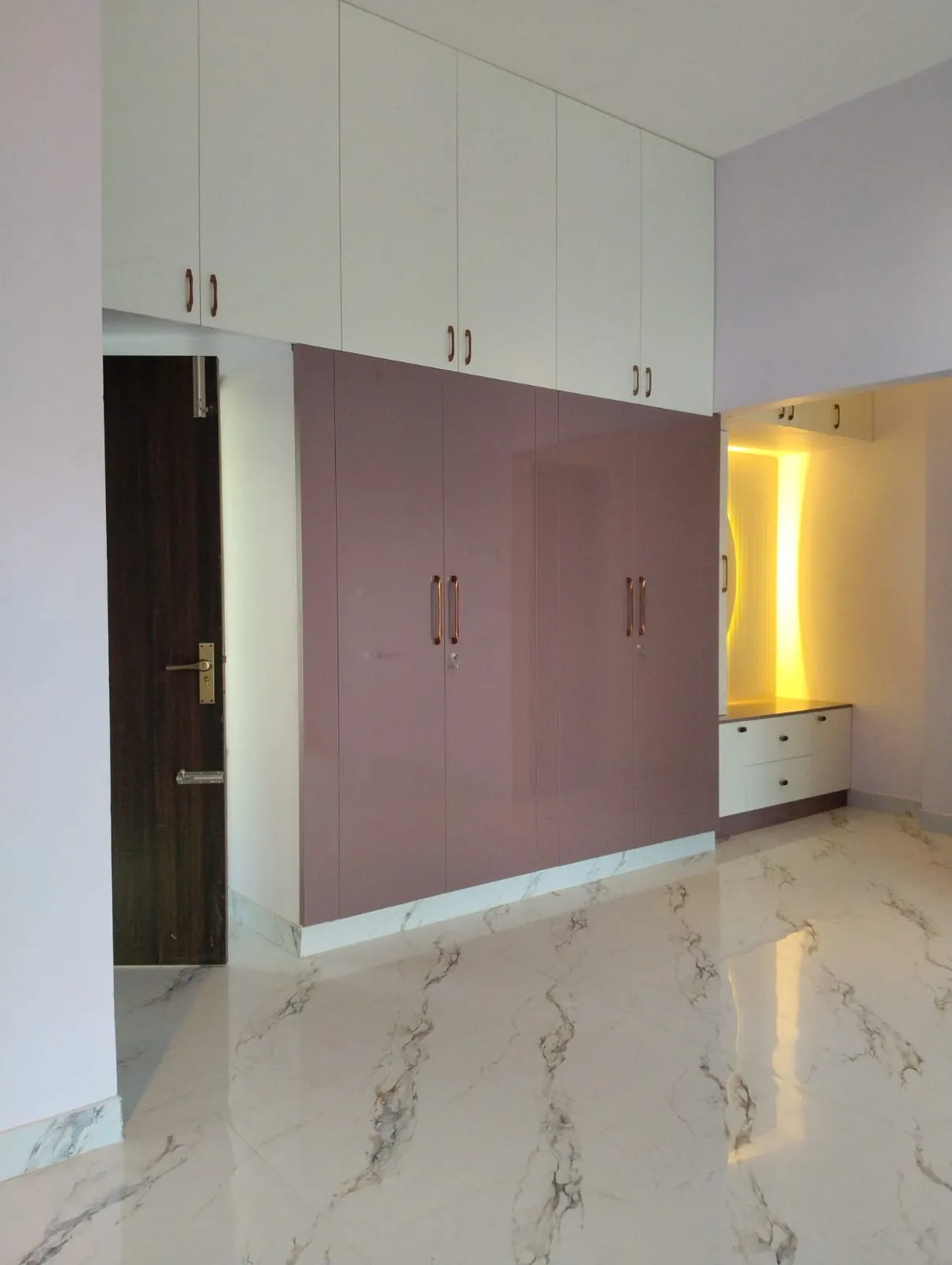 Unified Elegance Full-Height Wardrobe with Over-Door Loft and Integrated Vanity with Hinged Wardrobes at Deskanddecor