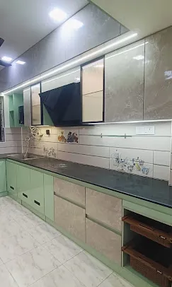 Straight-Line Modular Kitchen – Pastel Green & Marble Finish with Modular Kitchen at Deskanddecor