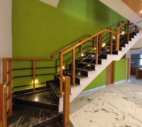 Wooden Handrail Dog-Legged Staircase with Black Marble Treads with Staircase Design at Deskanddecor