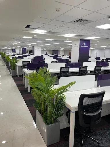 Large Corporate Open Office with Purple-Accent Workstations with Corporate Office Layouts at Deskanddecor