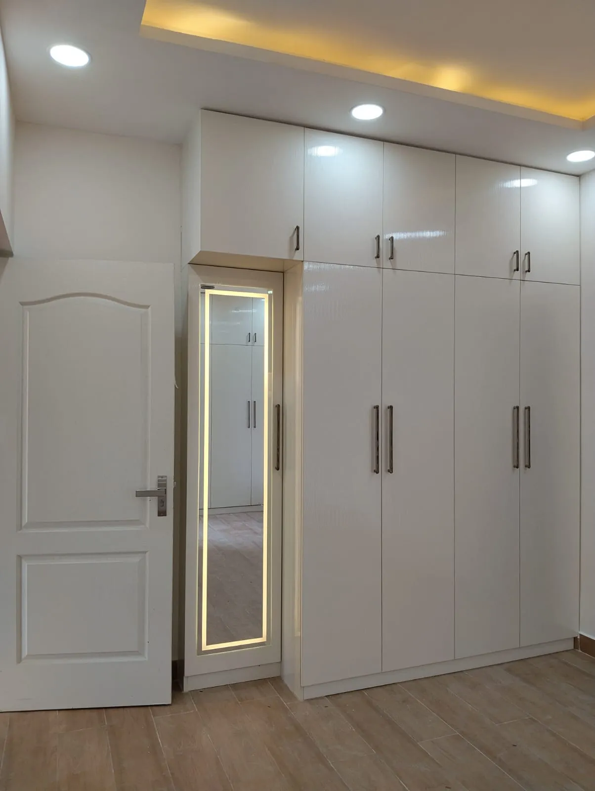 "Modern High-Gloss White Hinged Wardrobe with Integrated LED Dresser Mirror" with Hinged Wardrobes at Deskanddecor